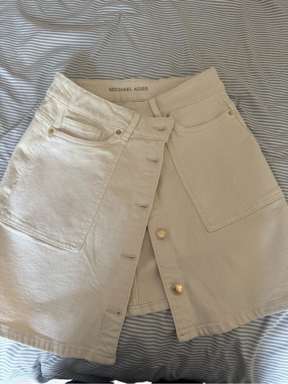 Michael Kors: Button-Front Cream Mini Skirt